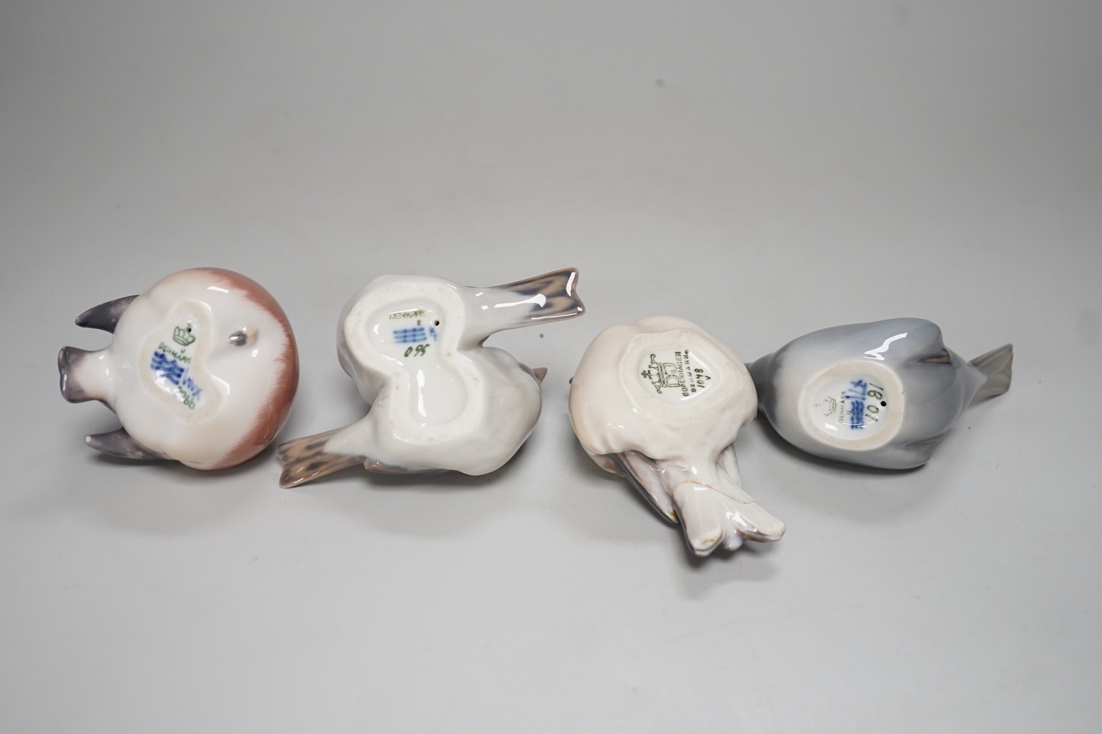 Four Copenhagen models of birds. Tallest 8cm